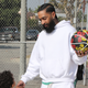 Nipsey Hussle greets kids at the Nipsey Hussle x PUMA Hoops Basketball Court Refurbishment Reveal Event on October 22, 2018 in Los Angeles, California.